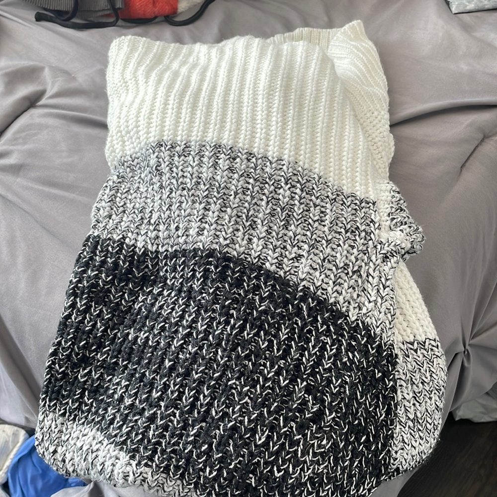 Marie says cardigan colors vary from white cream to gray to black